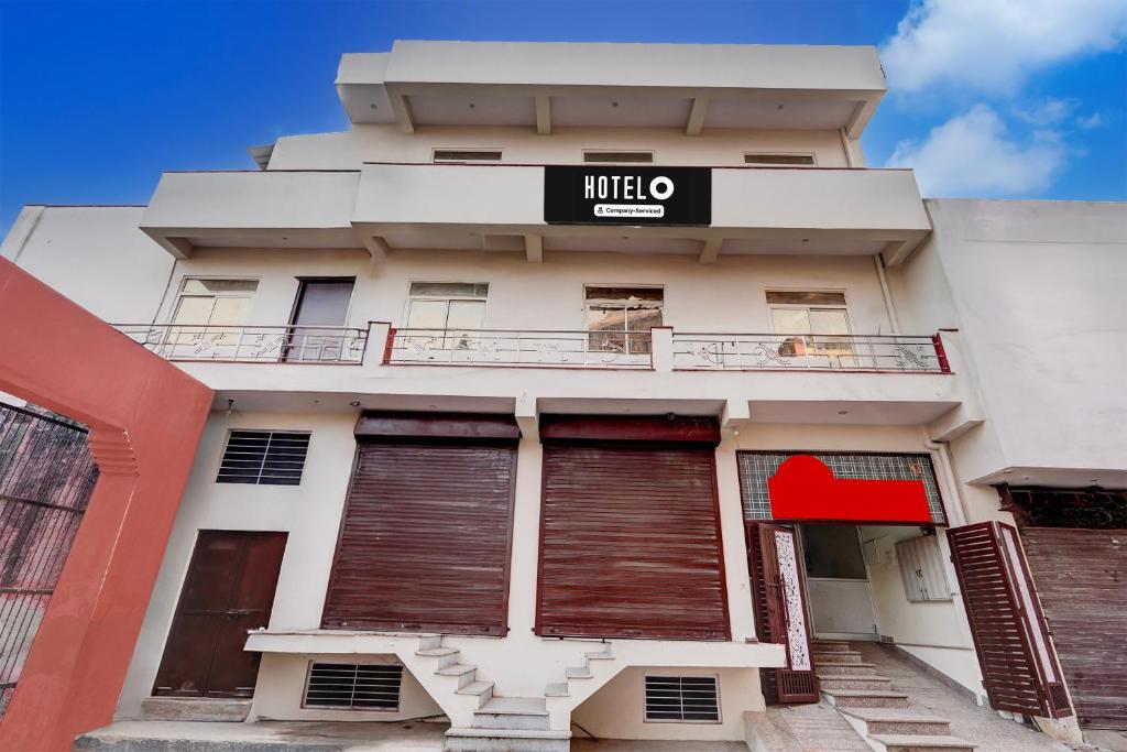 a building with a hotel sign on it at Hotel O Railway Station Road Formerly Alwar Delight in Alwar