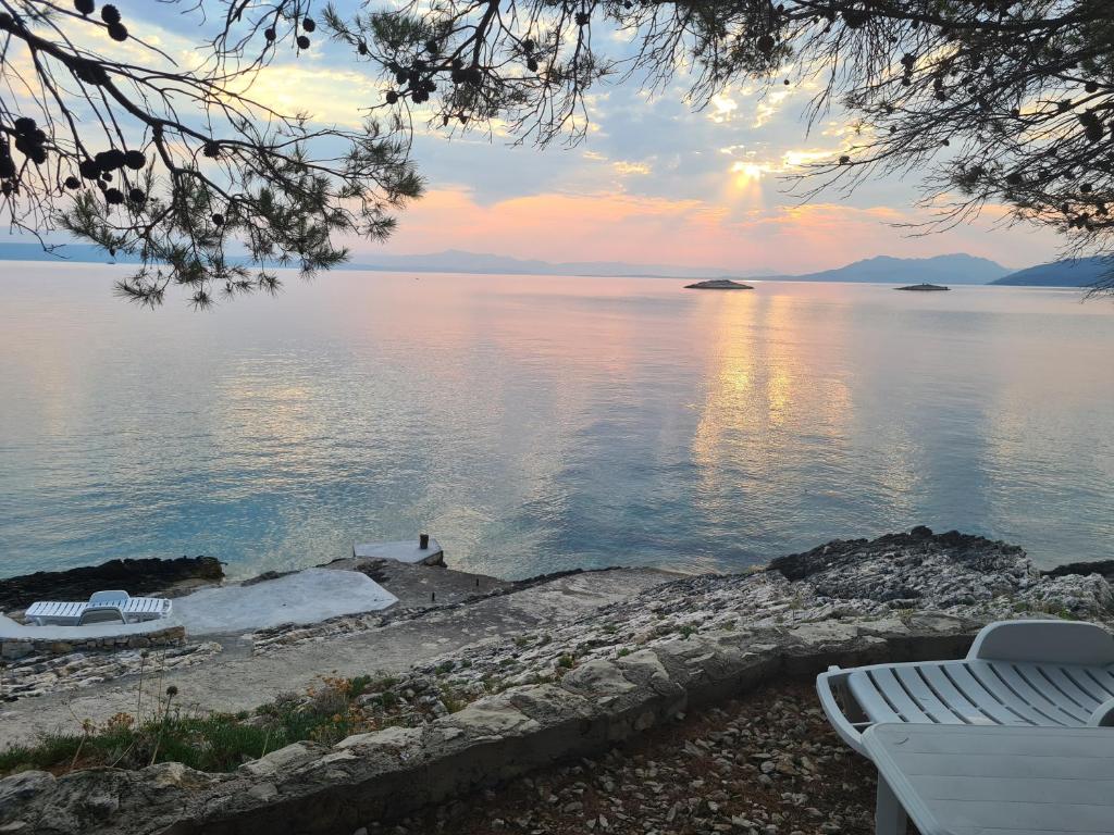 a view of a body of water at sunset at Vila Elena in Prigradica