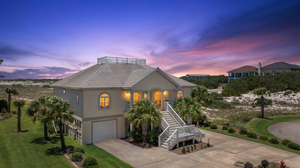 an aerial view of a house with palm trees at Gulf View Beach Home with Pool in Gulf Shores