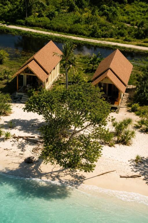an aerial view of two bungalows on a beach at The Sunrise Point in Katiet