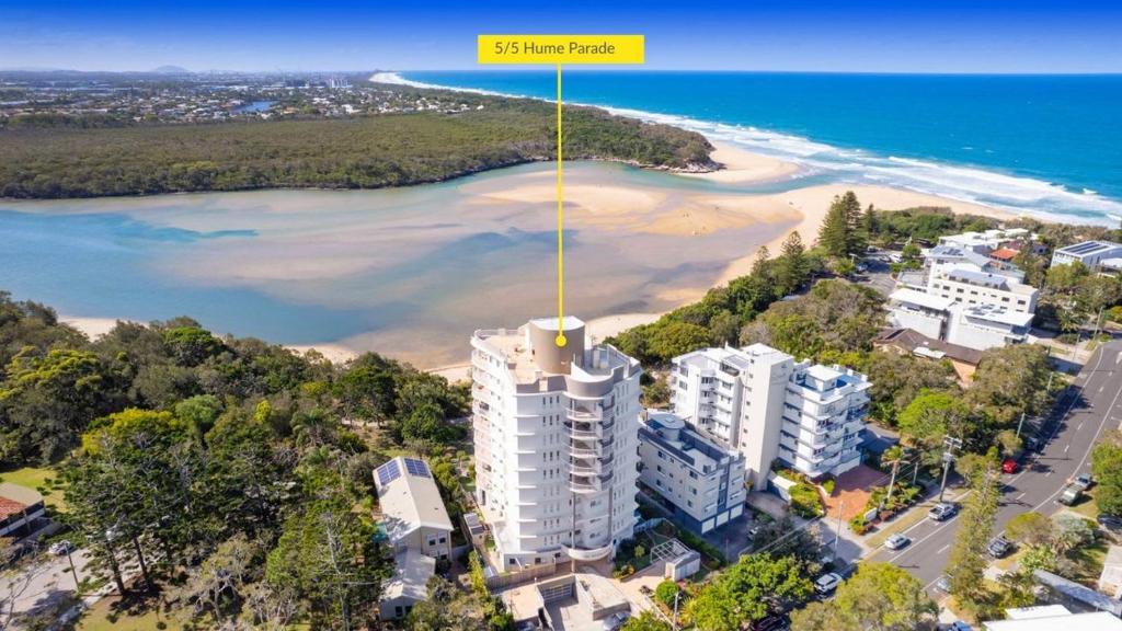 an aerial view of a building and a beach at The Entrance Unit 5 in Kawana Waters