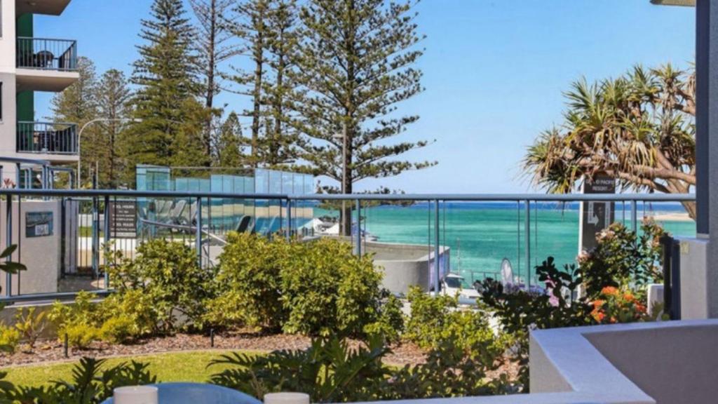 a view of the ocean from a balcony of a building at Grand Pacific Unit 10 in Caloundra