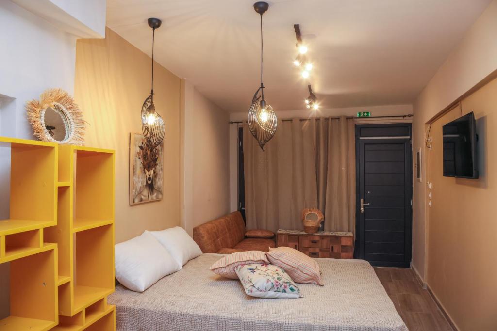 a bedroom with a bed with two pillows on it at Cozy Twins - Petra in Kavála