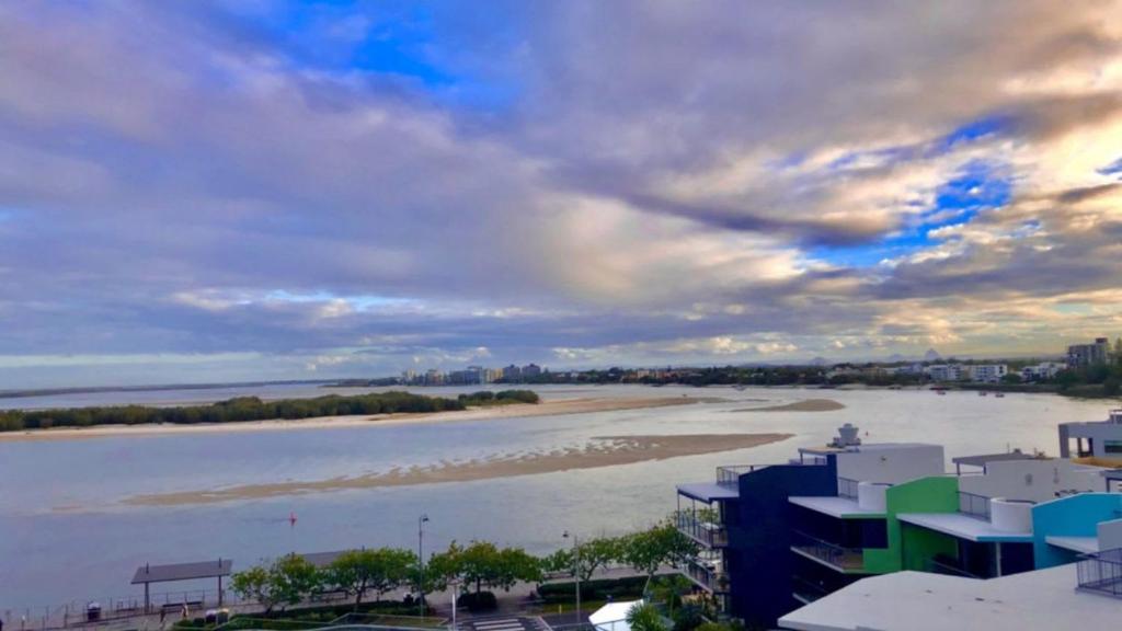 a view of a body of water with buildings at Amazing Views, Walk Everywhere! in Caloundra