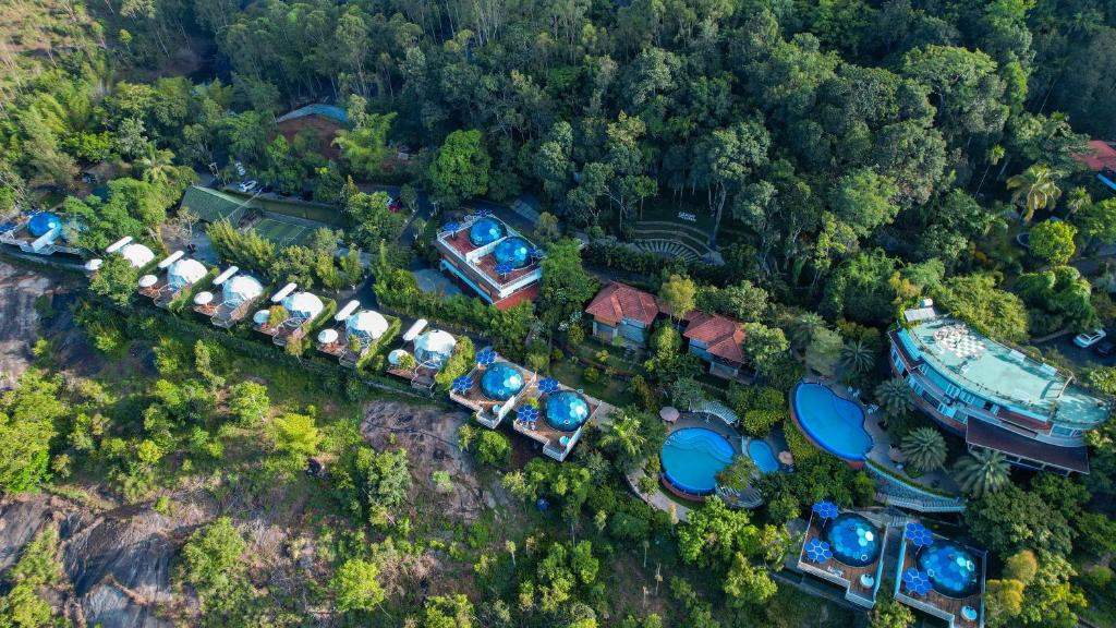 an aerial view of a resort with a building at Mount Xanadu Resorts in Ambalavayal