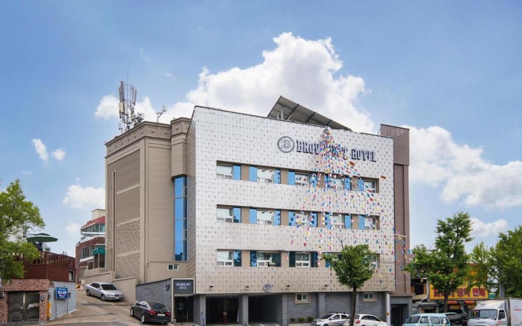 a building with decorations on the side of it at Daegu Brown Dot Hotel Kyungpook National University in Daegu