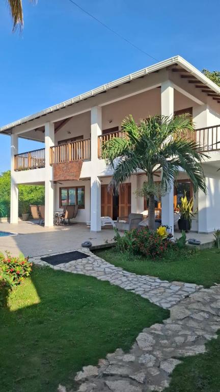 a large house with a walkway in front of it at Casa de Playa Antawara in El Porvenir