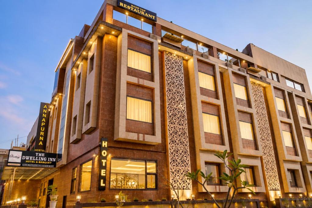 a building with lights on the side of it at The Dwelling Inn in Greater Noida