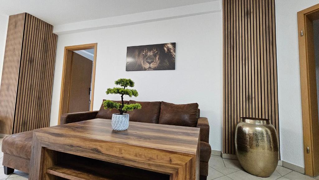 a living room with a table and a couch at Fewo-OPR de Billi in Wusterhausen