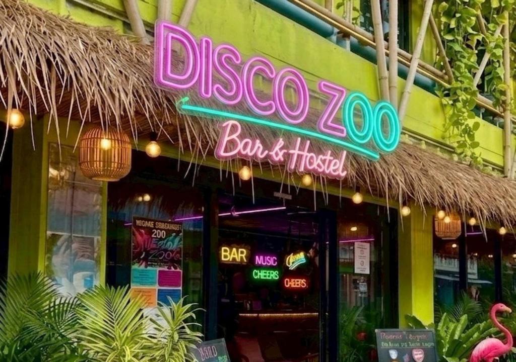 a restaurant with a neon sign on the front of it at DISCO ZOO Bar & Hostel in Haad Rin