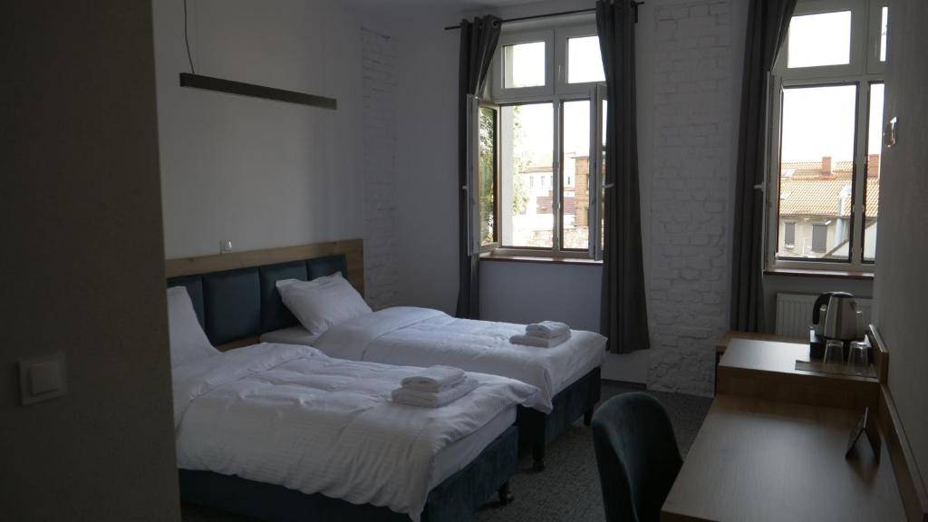 Postel nebo postele na pokoji v ubytování Hostel Pyskowice