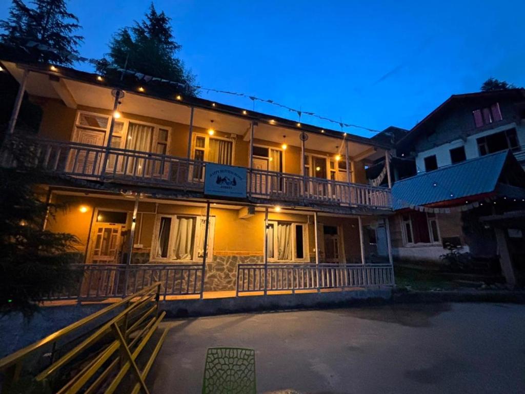 a large building with lights on it at night at Trio Nest in Jibhi
