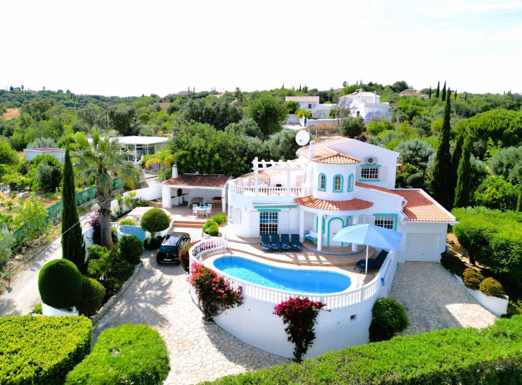 an aerial view of a house with a swimming pool at Luxury Casa da Fonte - Private Heated Salt Pool in Faro