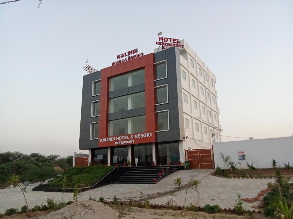 a building with a sign on top of it at The Kalindi Hotel and Resort in Hamīrpur