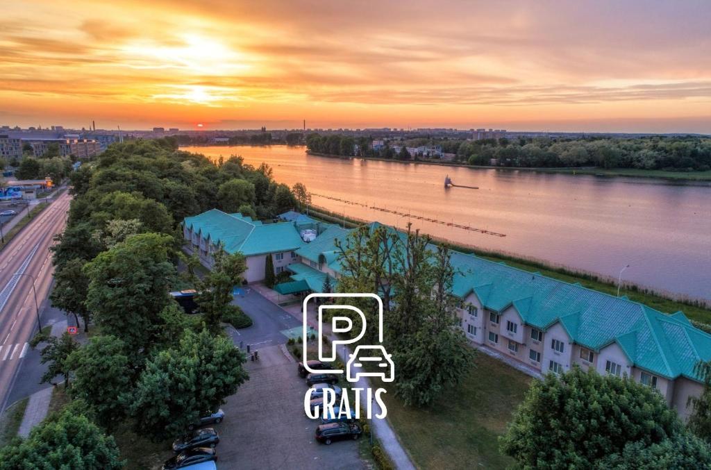 an overhead view of a building with a river at Hotel HP Park Poznań Malta in Poznań
