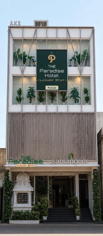 a building with a sign on the front of it at The Paradise Hotel - LUXURY STAY in Kanchipuram