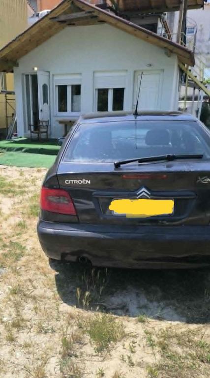 a car parked in front of a house at Summer Relax in Keramoti