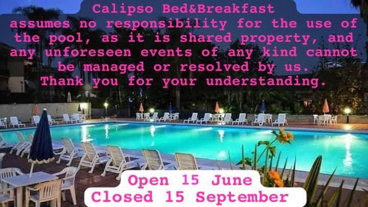 a sign for a swimming pool with chairs and a quote at Calipso Bed&Breakfast in Catania