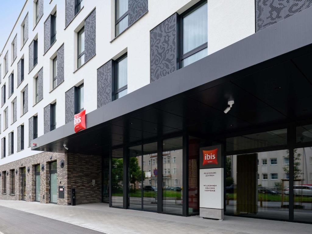 a building with a bfs sign in front of it at ibis Regensburg Zentrum in Regensburg