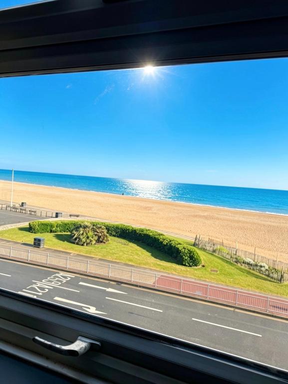 a view of the beach from a bus window at Central location Sea view in Hastings