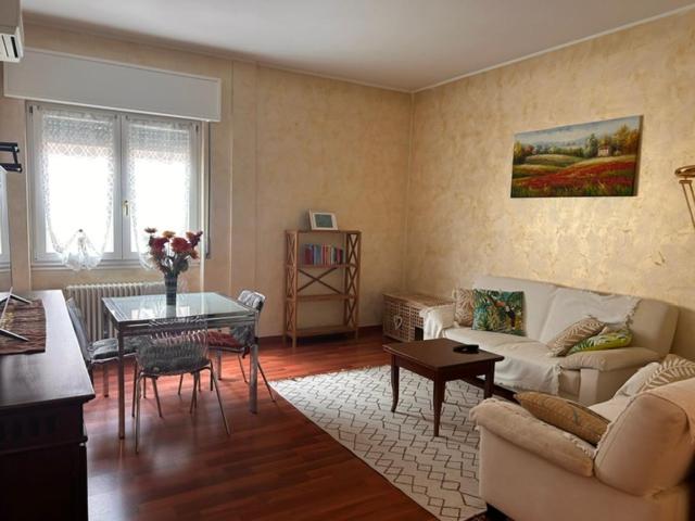 a living room with a couch and a table at Casa dei Navigatori in Verona