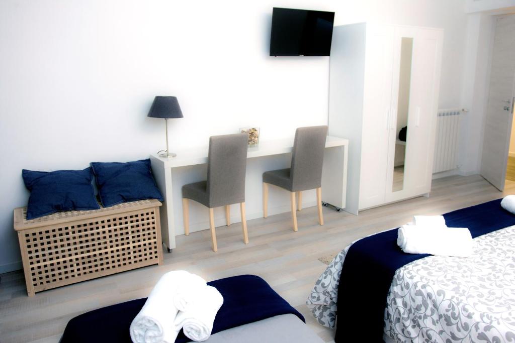 A bed or beds in a room at De Guestibus
