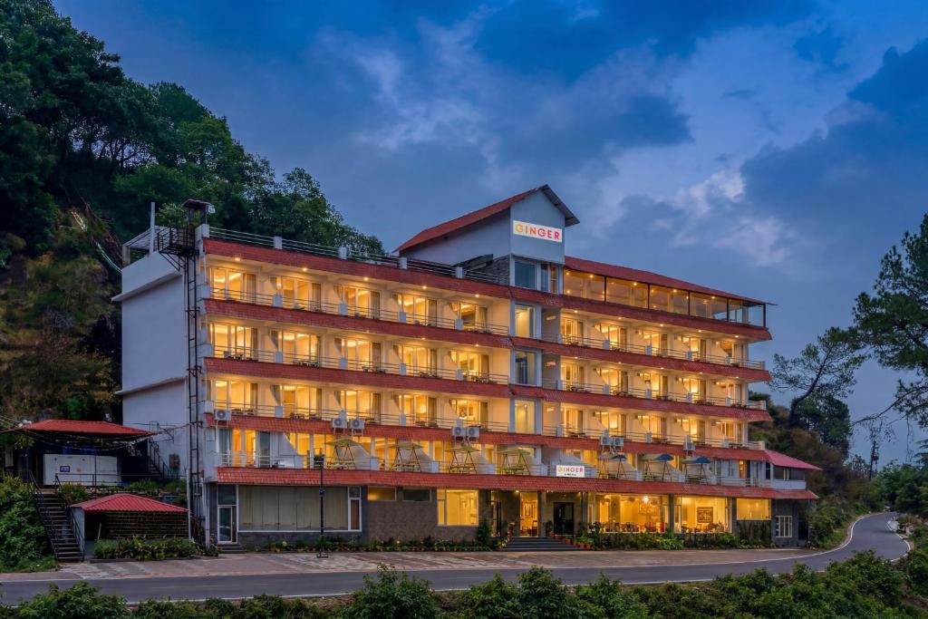 a hotel building with its lights on at Ginger Lansdowne, Mall Road in Lansdowne