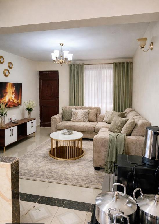 a living room with a couch and a table at Kitengela two bedroom stays in Kitengela 