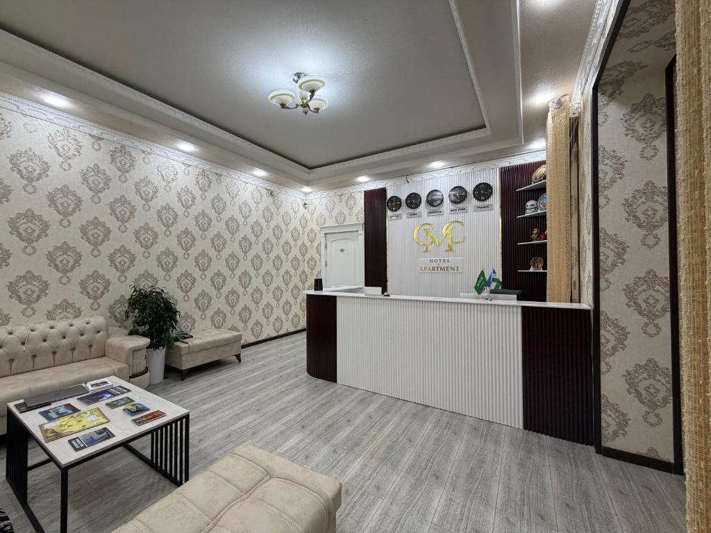 a lobby of a store with a counter and a table at CMC Hotel Apartment in Samarkand