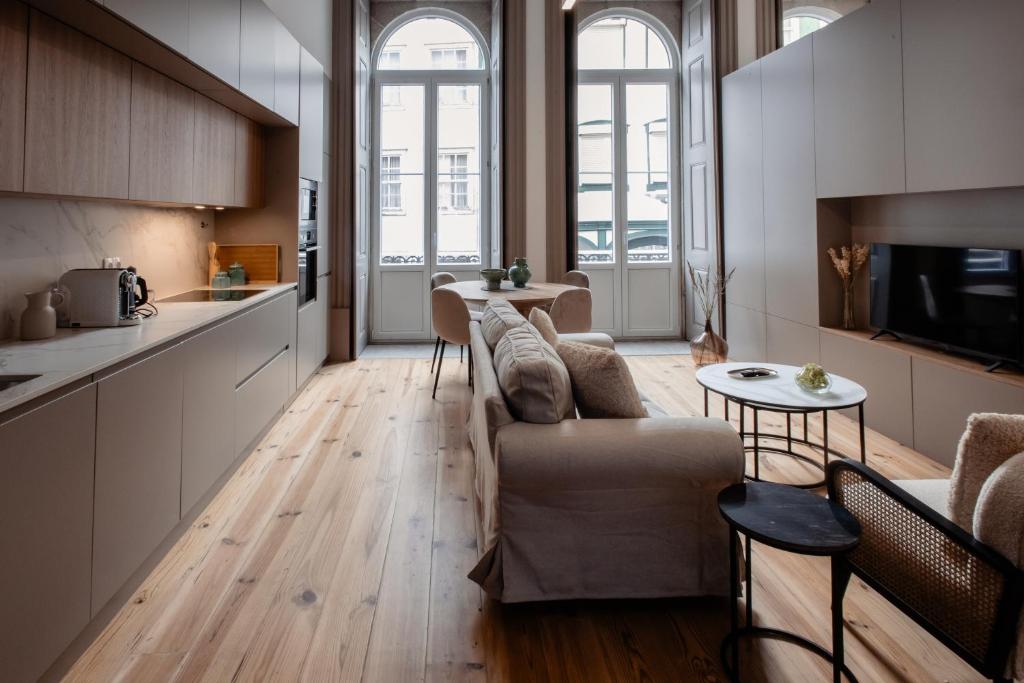 a living room with a couch and a table at Darm in Lamego