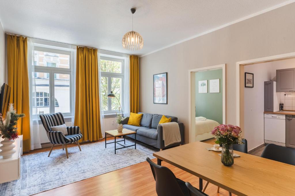 a living room with a couch and a table at Altstadt Suite in Freiberg