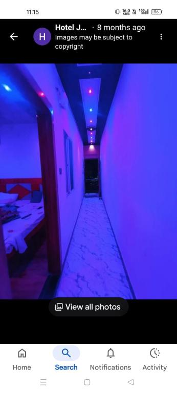 a screenshot of a purple room with a hallway at Hotel shree jagannath palace in Ujjain