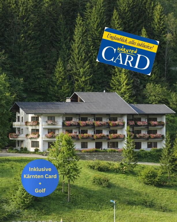 a hotel yard with a sign in front of it at Hotel Haus Sonnblick in Bad Kleinkirchheim