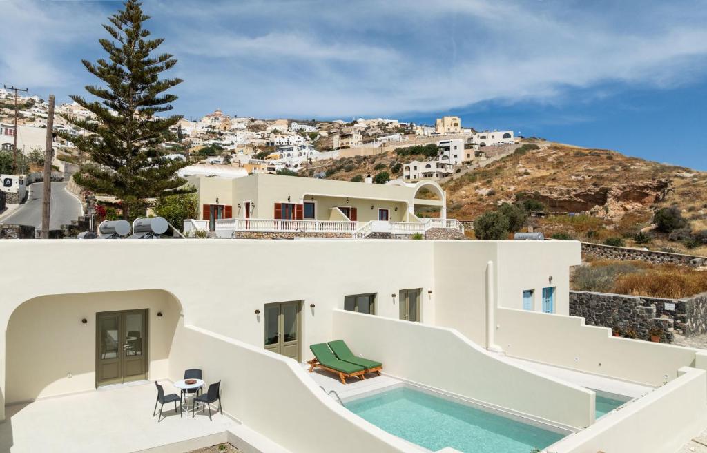 a view of a villa with a swimming pool at Kaminia Holiday Homes in Éxo Goniá