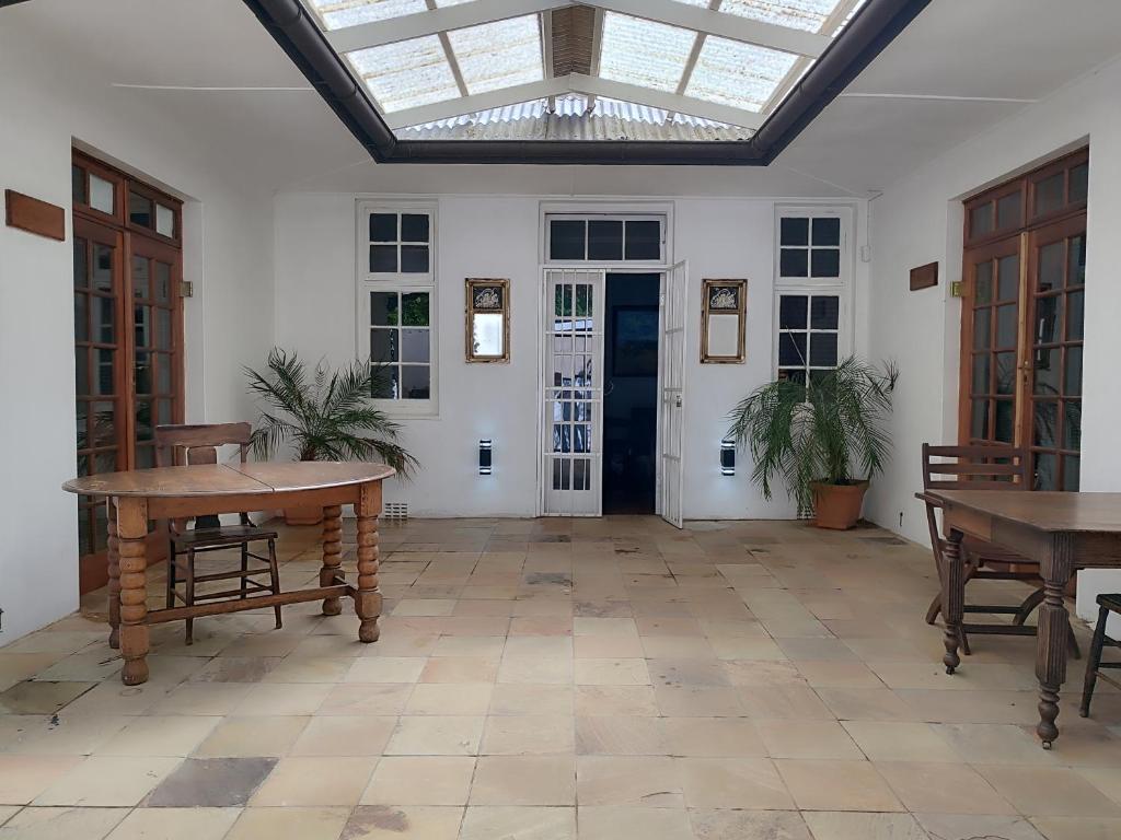 a large room with tables and a skylight at The Theatre in Bedford