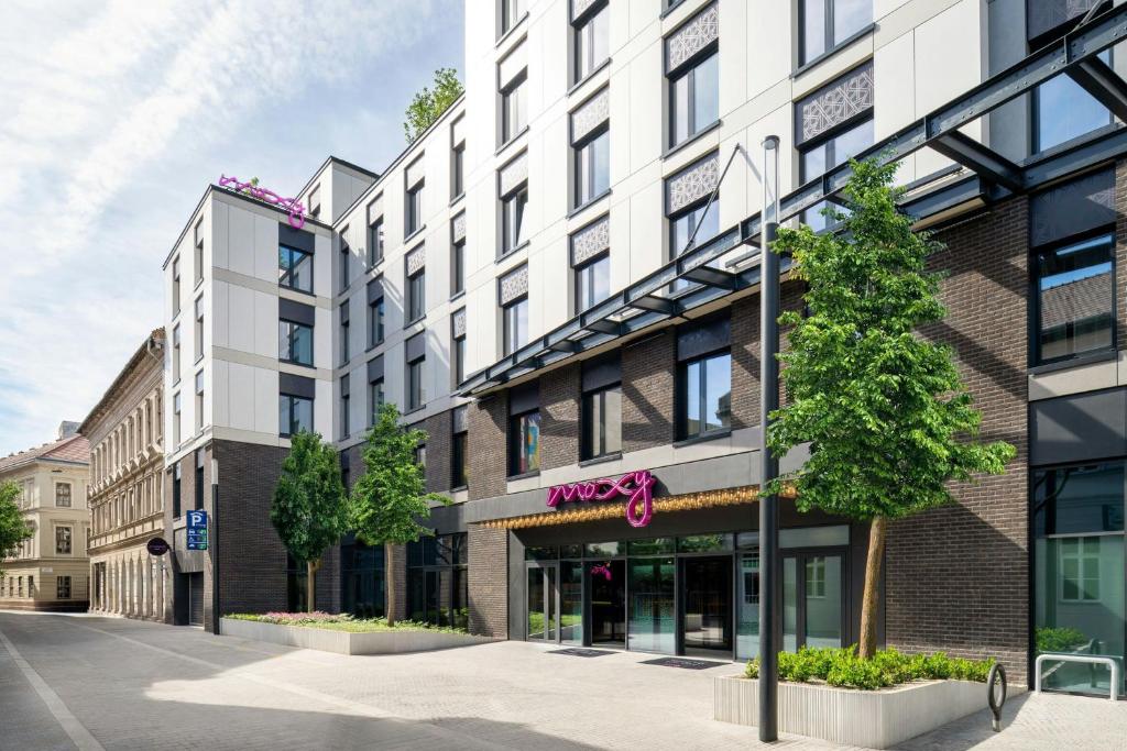a rendering of the moxy hotel on a city street at Moxy Budapest Downtown in Budapest