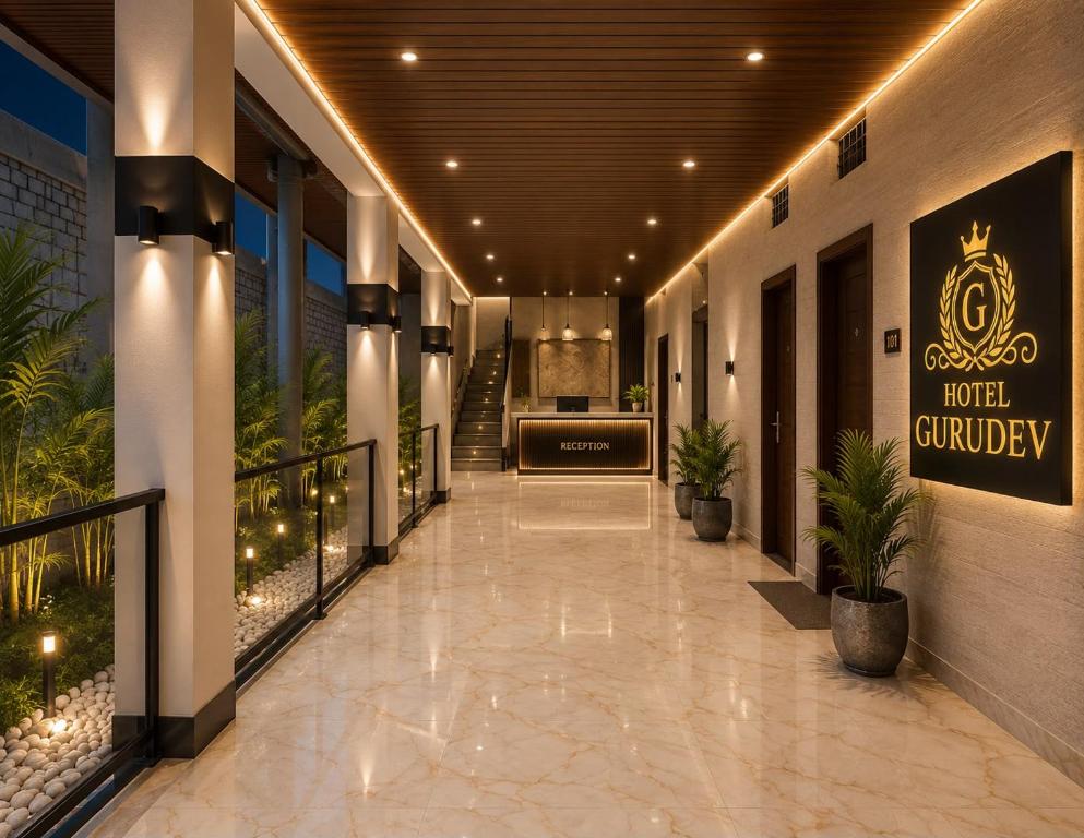 a hallway of a hotel lobby with a sign that reads hotelancy at Avigat Kabir hotel sanwer in Sānwer