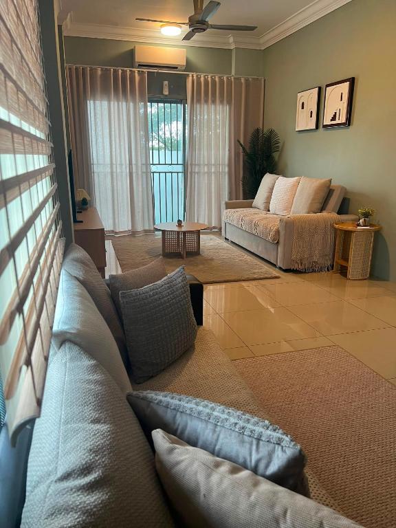 a living room with a couch and a table at LS homestay Ipoh in Chemor