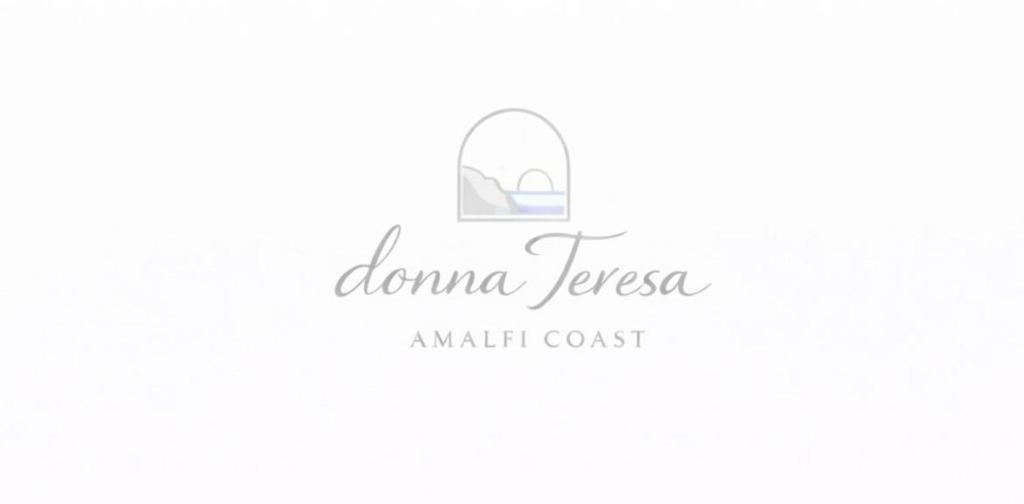 a logo for a makeup resort with a bag at Donna Teresa Amalficoast in Cetara