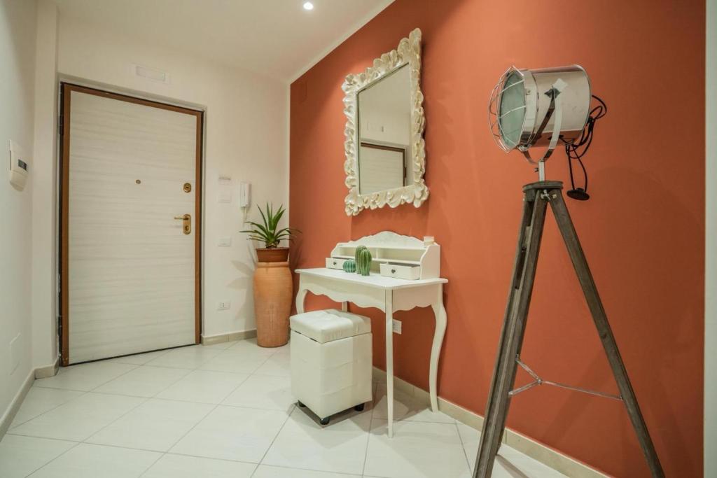 a camera on a tripod in a bathroom with a sink at Oltremura Rooms Agropoli in Agropoli