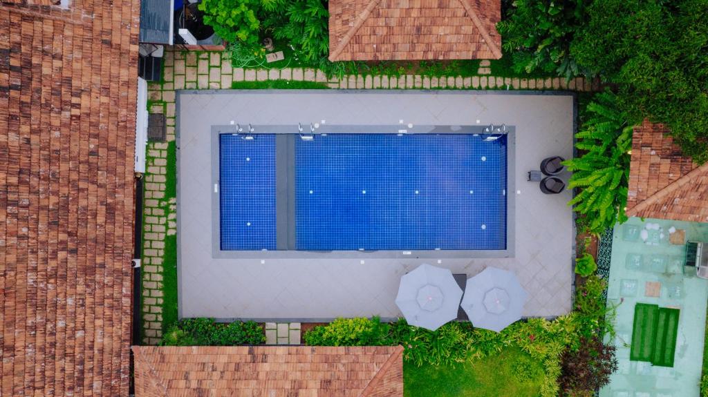 an overhead view of a building with a large window at SVS Arena in Kizhake Chālakudi