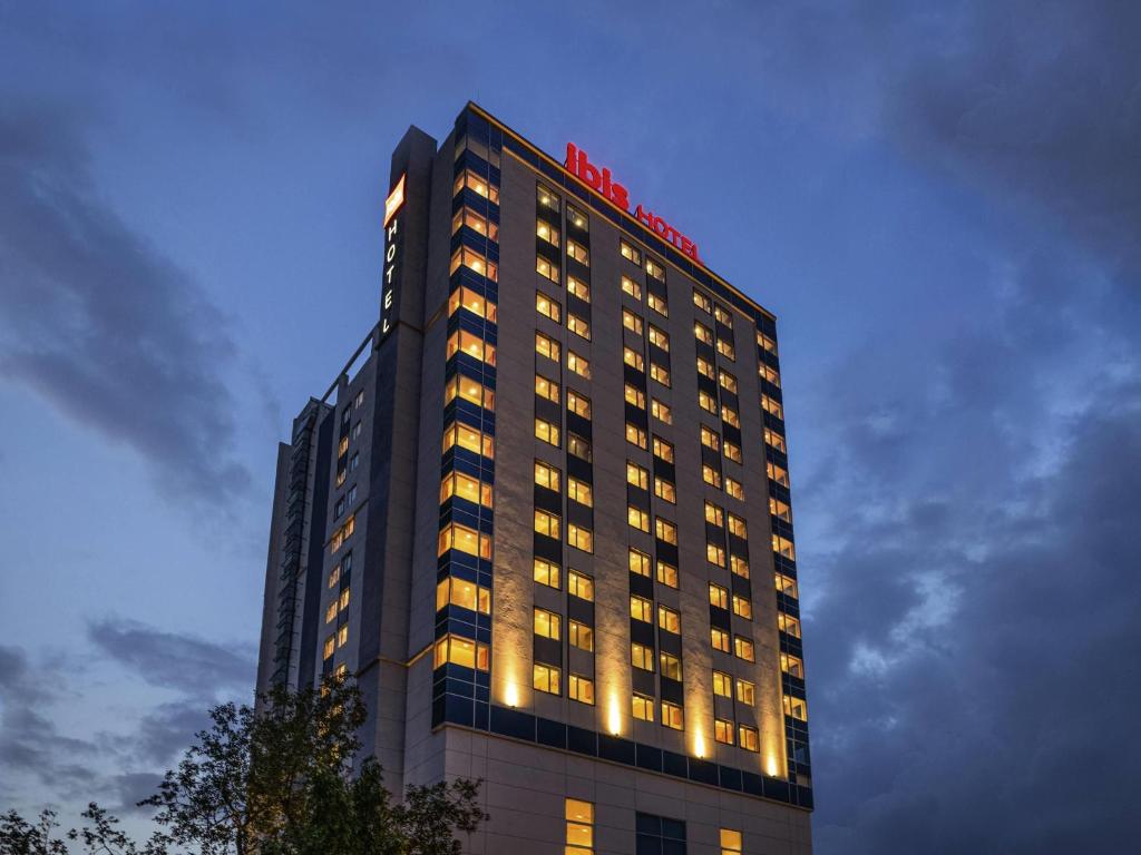 a tall building with a m hotel sign on it at ibis Mumbai Vikhroli - An Accor Brand in Mumbai