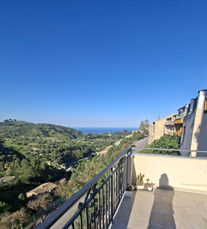 a view of the ocean from the balcony of a house at La Casa di Mimma in Badolato