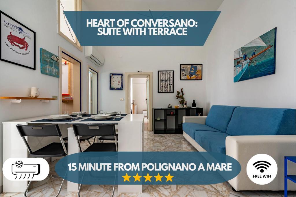 a living room with a blue couch and a table at 15min Polignano Puglia Historical Center Terrace in Conversano