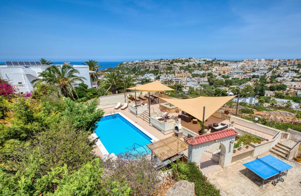an aerial view of a swimming pool in a villa at D View 4 You in Mellieħa