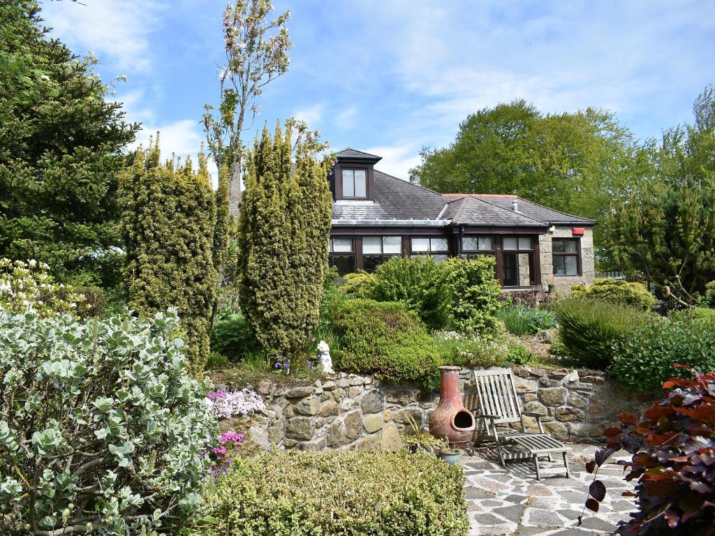 a house with a garden in front of it at Middle Lodge in Mintlaw