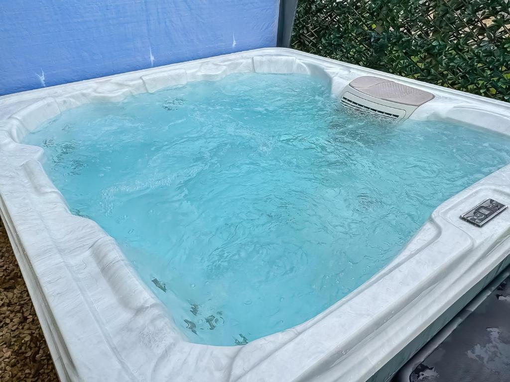 a hot tub with a thermometer in it at Whispering Pines Spa - Uk50087 in Durham