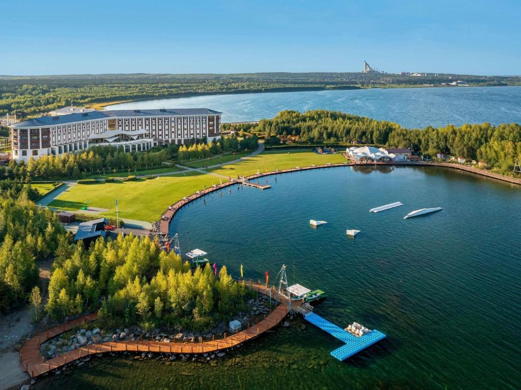 an island in the middle of a large lake at Rixos Borovoe in Borovoye