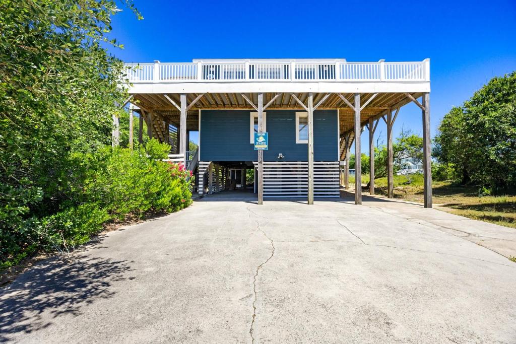 a large blue building with a white roof at 1030 - La Ballena Cottage in Corolla