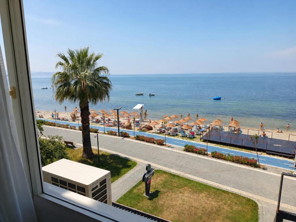 a view of the beach from a balcony of a resort at Grand Erdek Hotel in Erdek